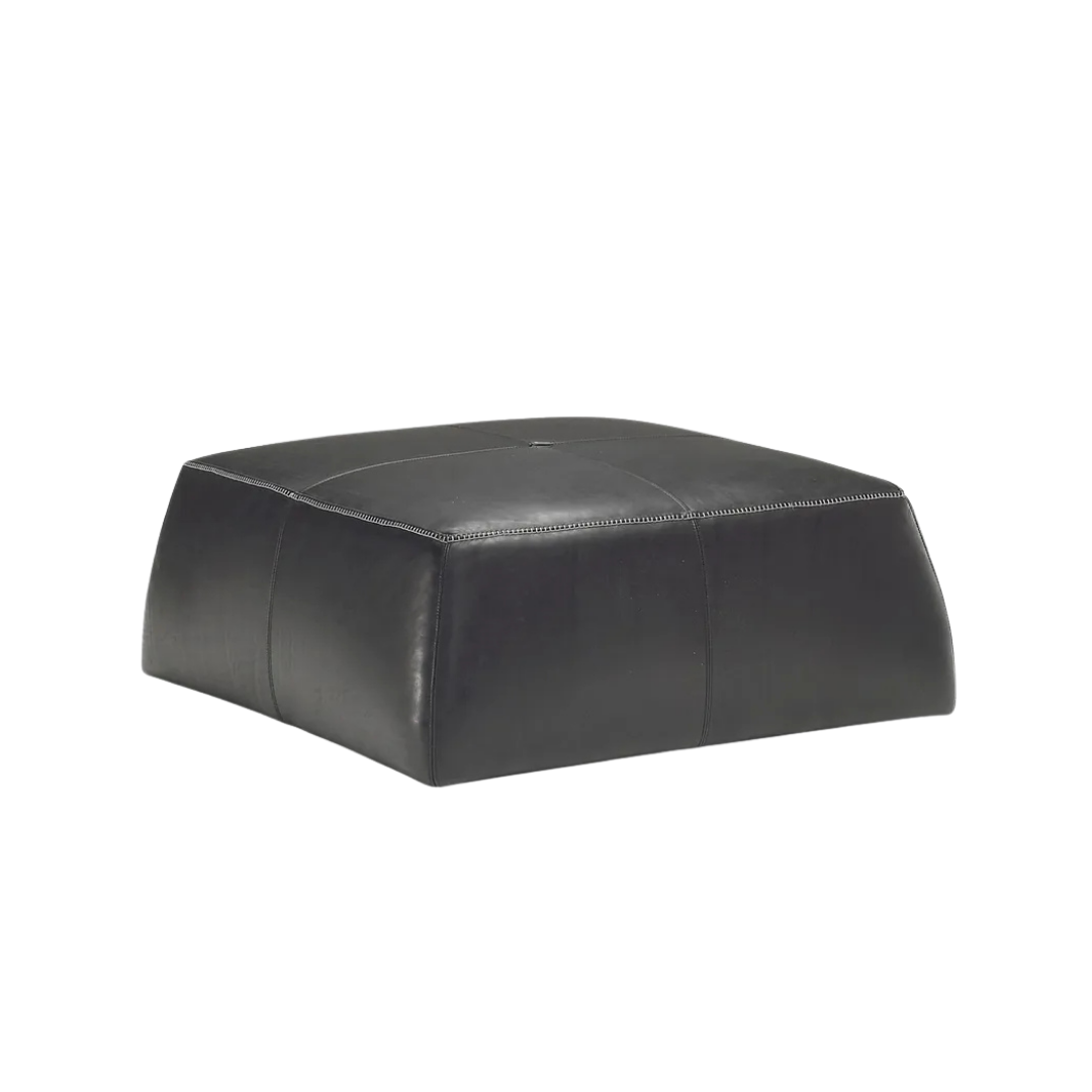 Natuzzi Italia indoor furniture including lounge armchairs, coffee tables, side tables, and bedside tables at Royal Interiors Singapore showroom.