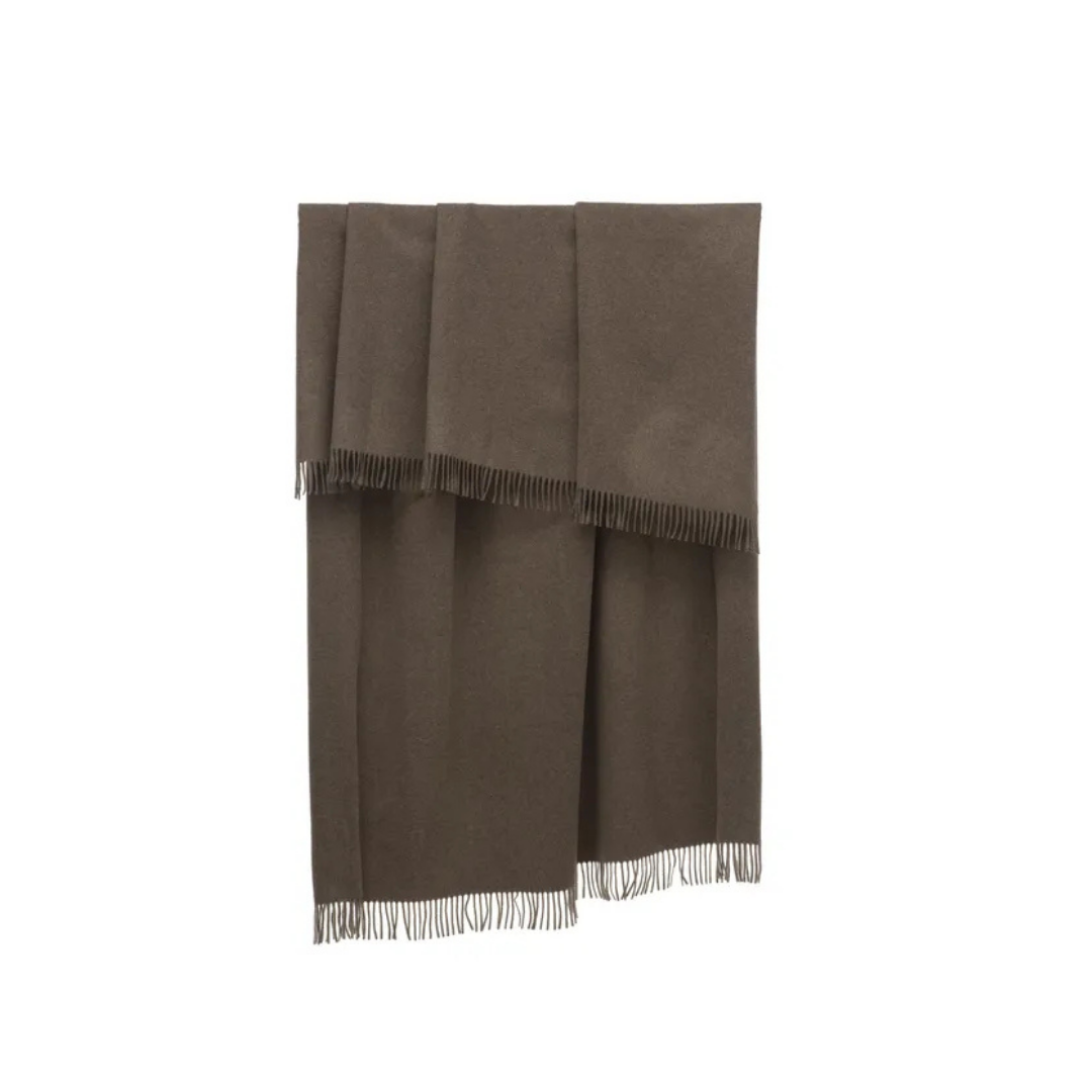 Natuzzi Italia indoor furniture including lounge armchairs, coffee tables, side tables, and bedside tables at Royal Interiors Singapore showroom.