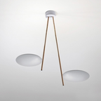 Catellani & Smith sculptural lighting displayed at Royal Interiors Singapore showroom, creating a warm and atmospheric setting for Chinese New Year interiors.