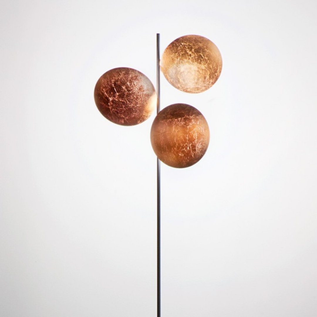 Catellani & Smith sculptural lighting displayed at Royal Interiors Singapore showroom, creating a warm and atmospheric setting for Chinese New Year interiors.