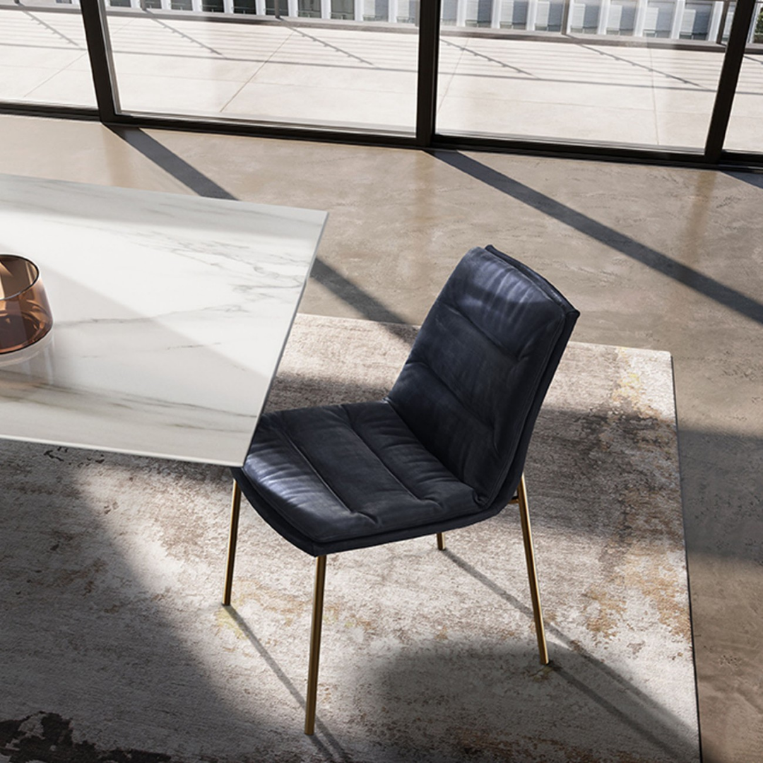 Eforma contemporary Italian furniture featuring sculptural tables and seating crafted in glass, marble, metal, and wood, displayed at Royal Interiors Singapore showroom