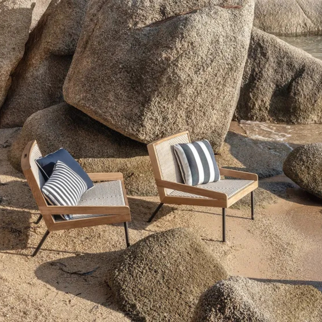 Ethimo Italian outdoor furniture in teak and refined finishes, displayed at Royal Interiors Singapore showroom