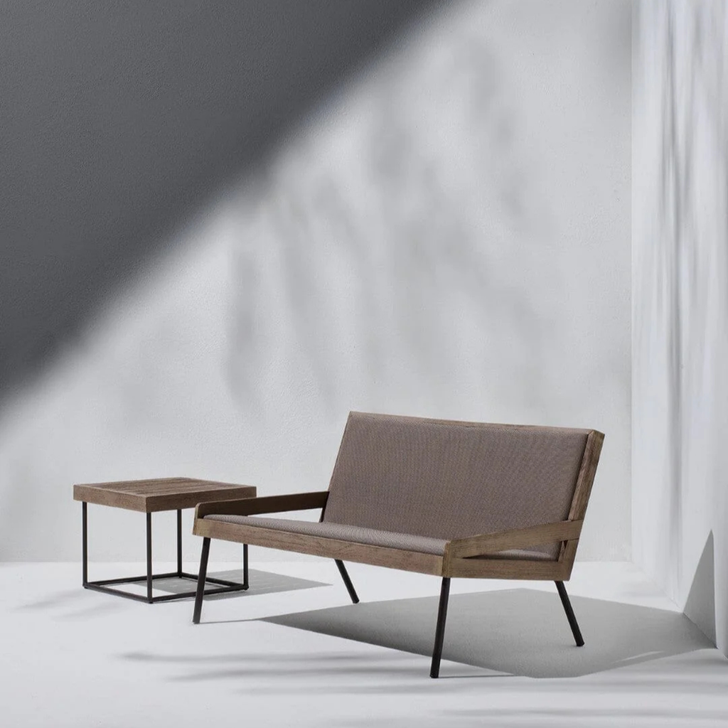 Ethimo Italian outdoor furniture in teak and refined finishes, displayed at Royal Interiors Singapore showroom