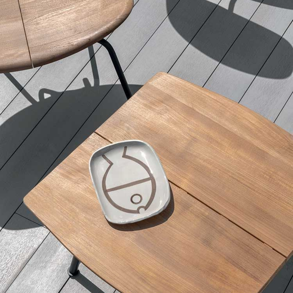 Ethimo Italian outdoor furniture in teak and refined finishes, displayed at Royal Interiors Singapore showroom