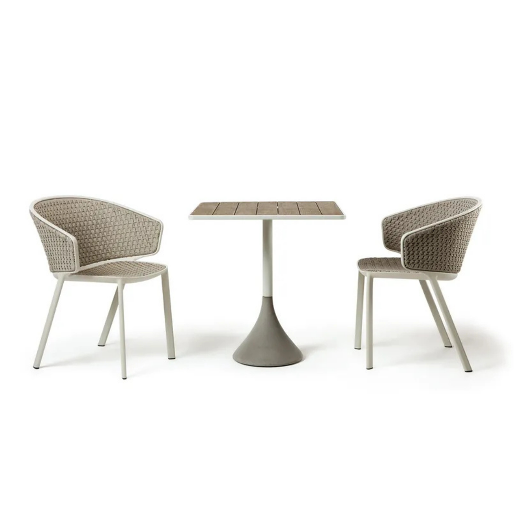 Ethimo Italian outdoor furniture in teak and refined finishes, displayed at Royal Interiors Singapore showroom