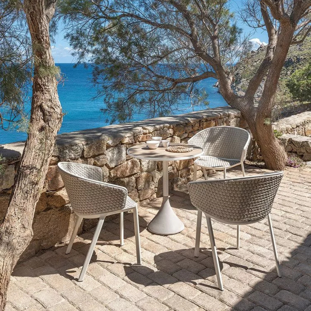 Ethimo Italian outdoor furniture in teak and refined finishes, displayed at Royal Interiors Singapore showroom