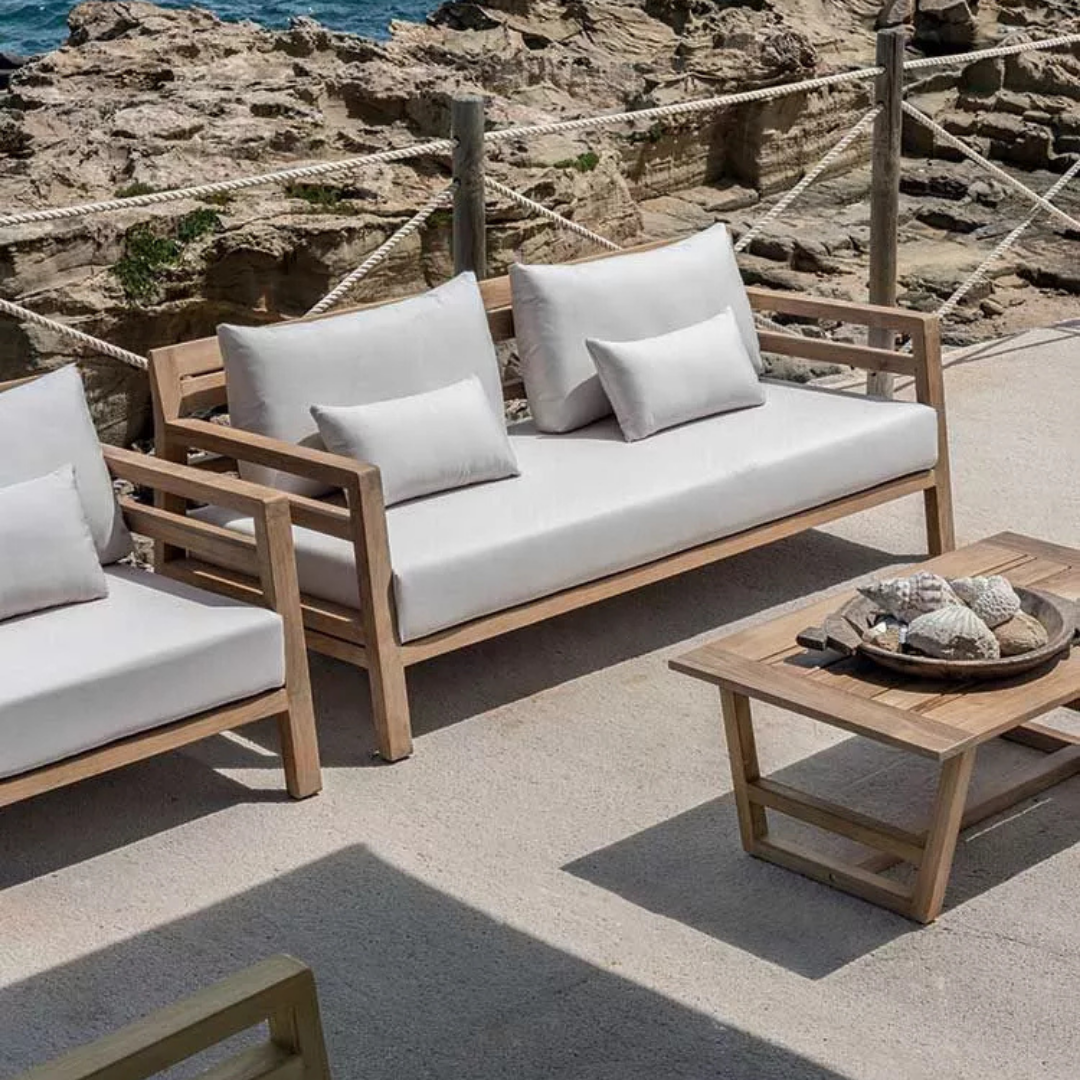 Ethimo Italian outdoor furniture in teak and refined finishes, displayed at Royal Interiors Singapore showroom