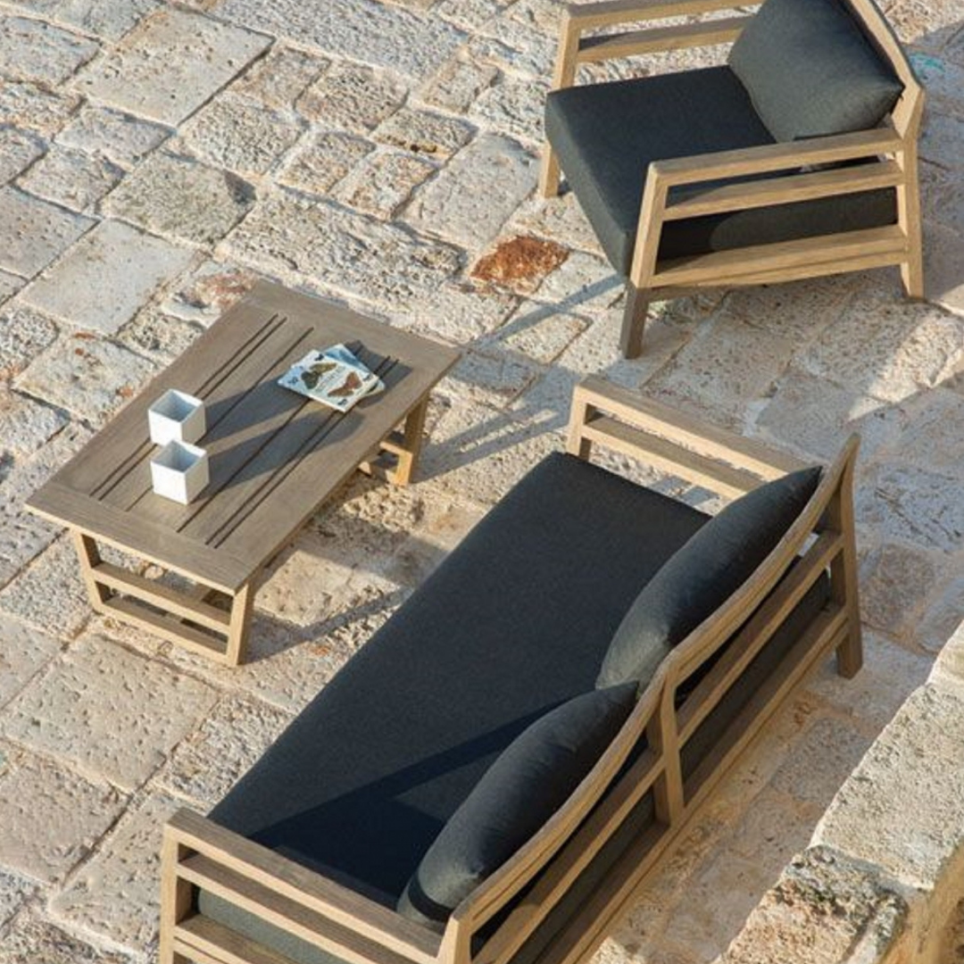 Ethimo Italian outdoor furniture in teak and refined finishes, displayed at Royal Interiors Singapore showroom