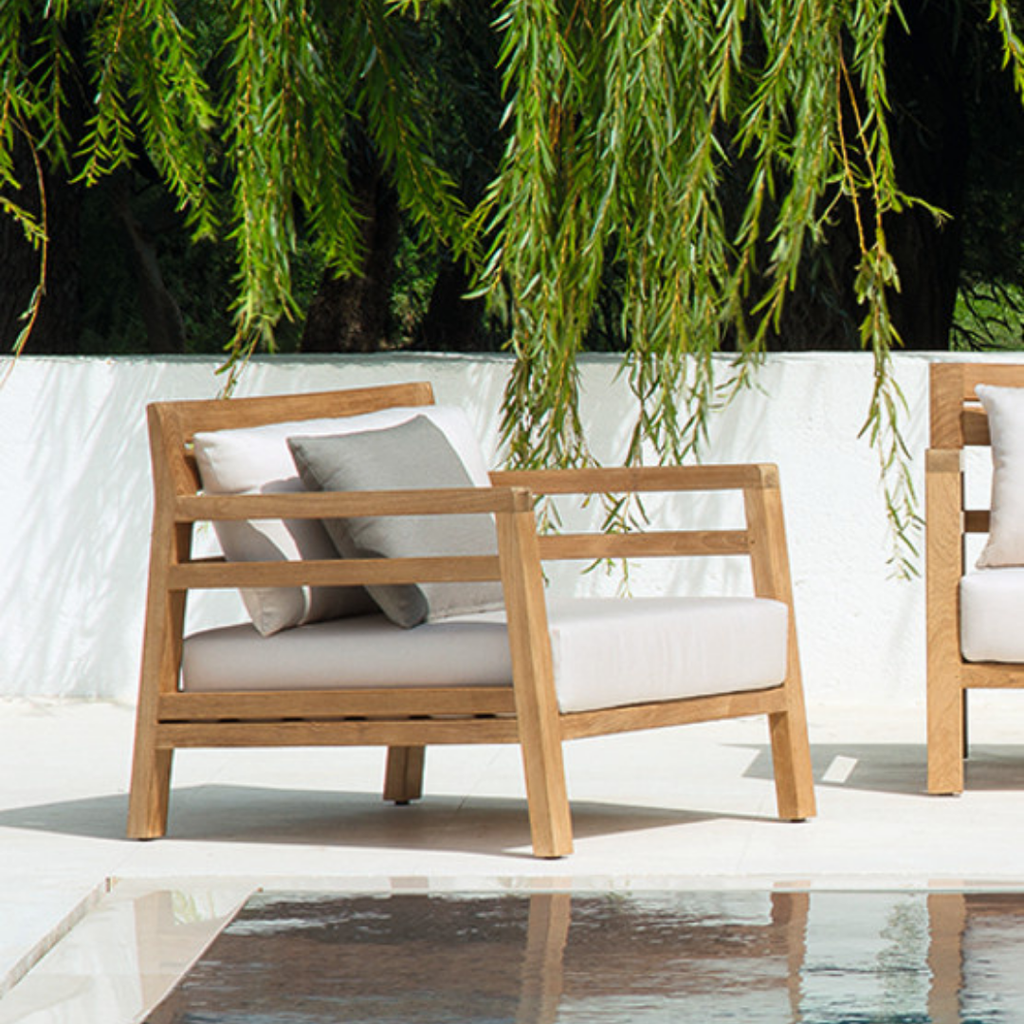 Ethimo Italian outdoor furniture in teak and refined finishes, displayed at Royal Interiors Singapore showroom