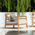 Ethimo Italian outdoor furniture in teak and refined finishes, displayed at Royal Interiors Singapore showroom