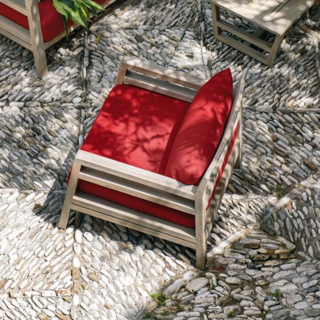 Ethimo Italian outdoor furniture in teak and refined finishes, displayed at Royal Interiors Singapore showroom