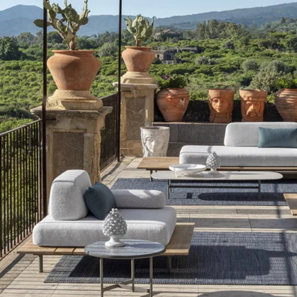 Ethimo Italian outdoor furniture in teak and refined finishes, displayed at Royal Interiors Singapore showroom