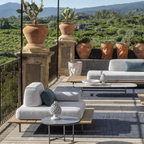 Ethimo Italian outdoor furniture in teak and refined finishes, displayed at Royal Interiors Singapore showroom