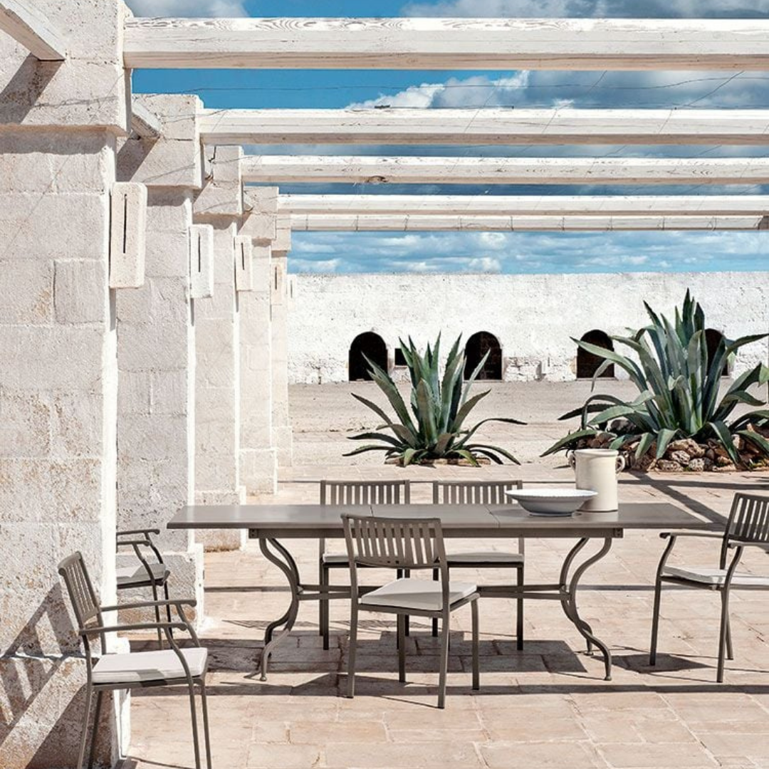 Ethimo Italian outdoor furniture in teak and refined finishes, displayed at Royal Interiors Singapore showroom