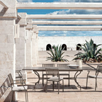 Ethimo Italian outdoor furniture in teak and refined finishes, displayed at Royal Interiors Singapore showroom