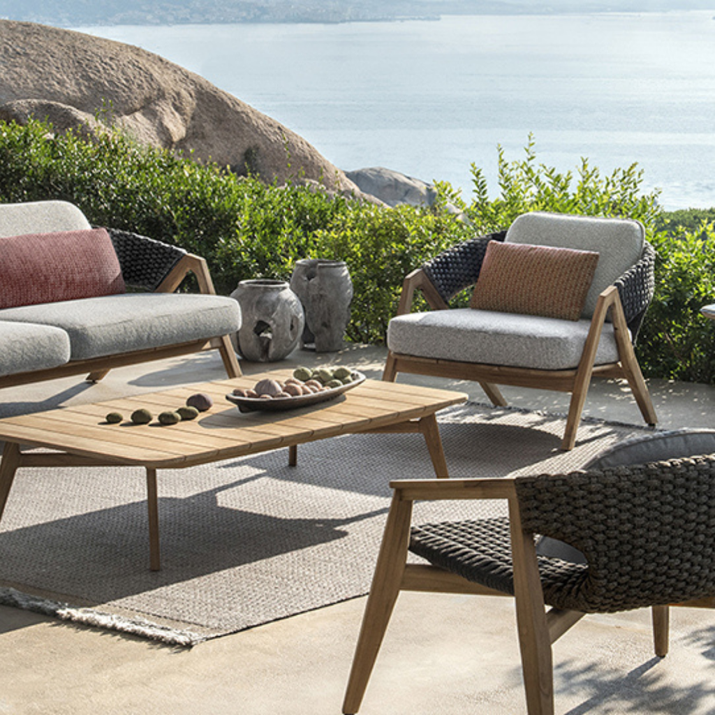 Ethimo Italian outdoor furniture in teak and refined finishes, displayed at Royal Interiors Singapore showroom