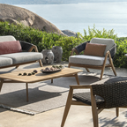 Ethimo Italian outdoor furniture in teak and refined finishes, displayed at Royal Interiors Singapore showroom