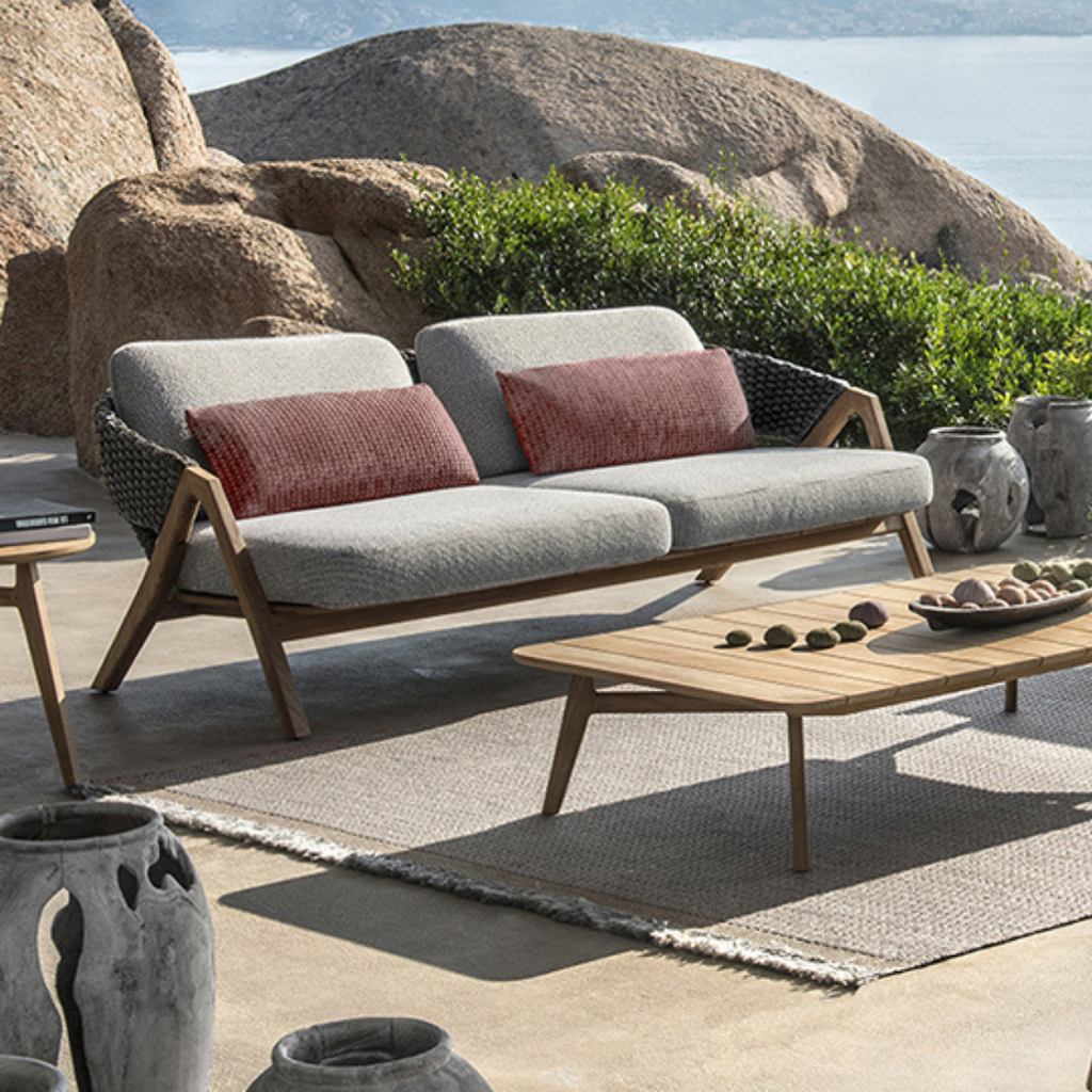 Ethimo Italian outdoor furniture in teak and refined finishes, displayed at Royal Interiors Singapore showroom