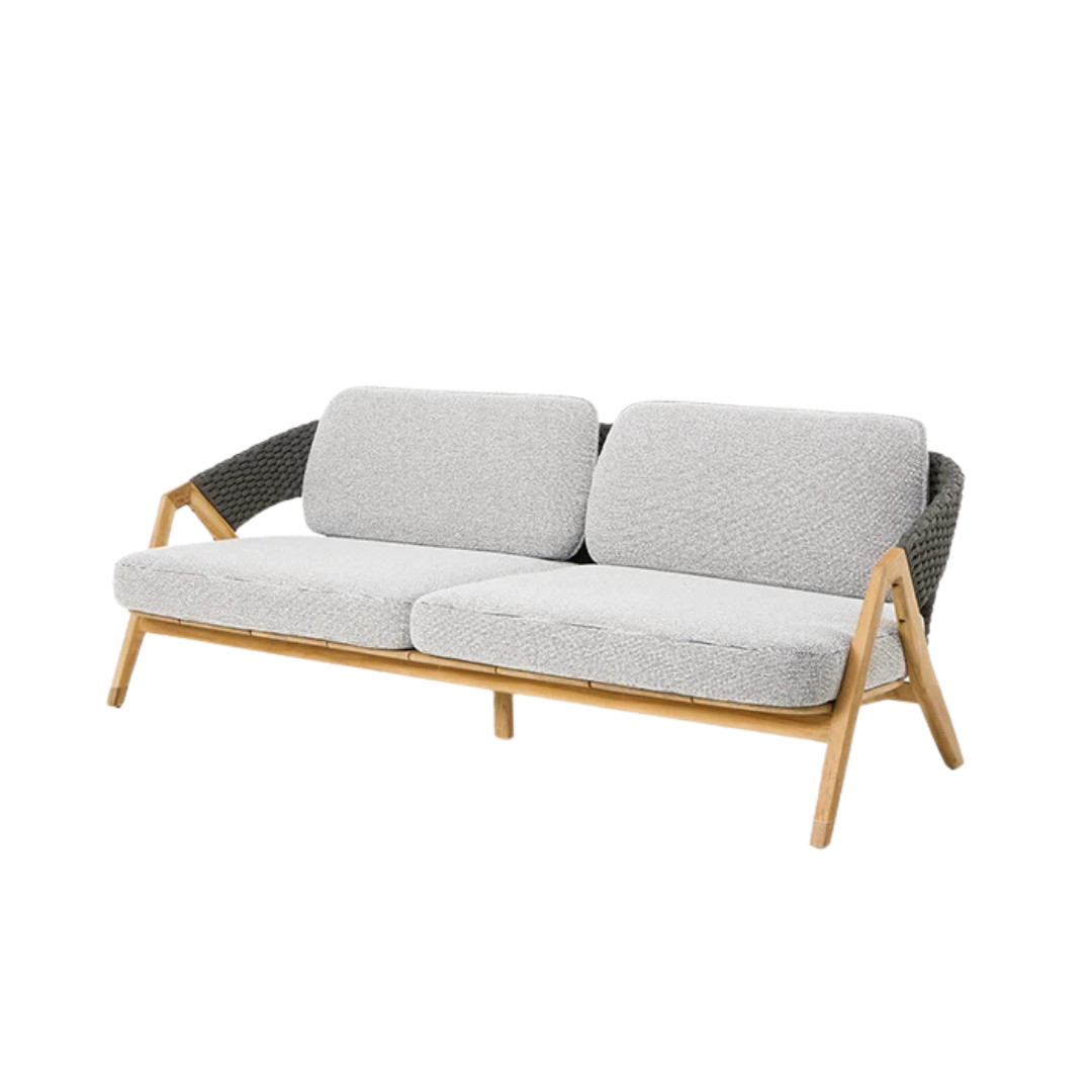 Ethimo Italian outdoor furniture in teak and refined finishes, displayed at Royal Interiors Singapore showroom