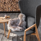 Ethimo Italian outdoor furniture in teak and refined finishes, displayed at Royal Interiors Singapore showroom