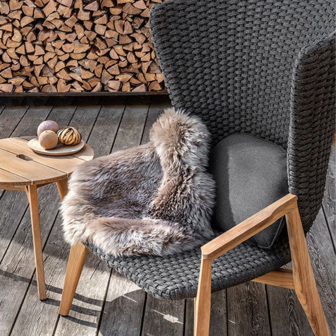 Ethimo Italian outdoor furniture in teak and refined finishes, displayed at Royal Interiors Singapore showroom