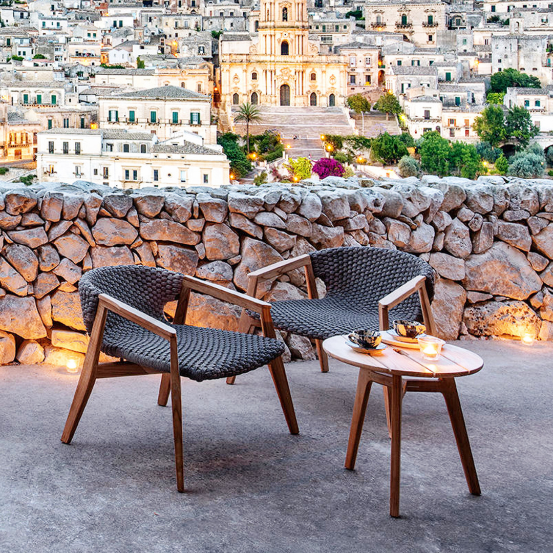 Ethimo Italian outdoor furniture in teak and refined finishes, displayed at Royal Interiors Singapore showroom