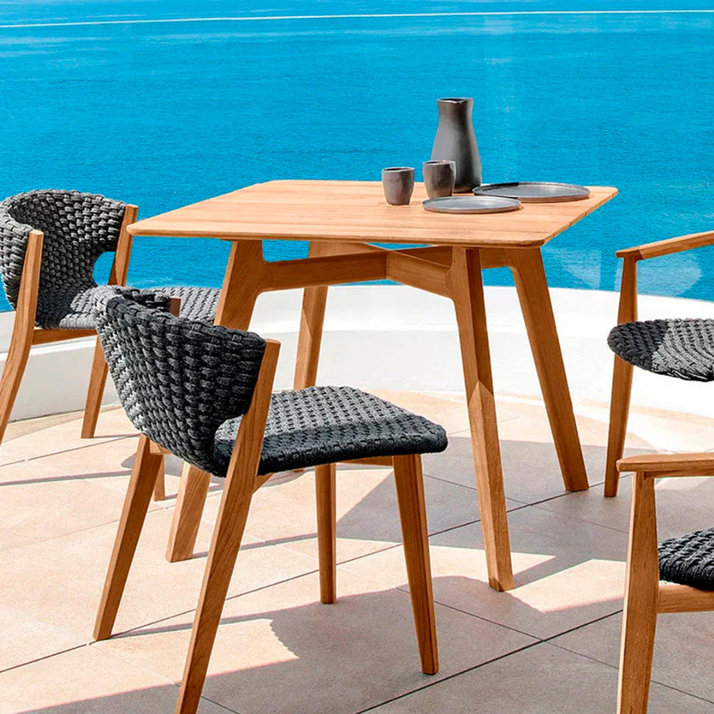 Ethimo Italian outdoor furniture in teak and refined finishes, displayed at Royal Interiors Singapore showroom