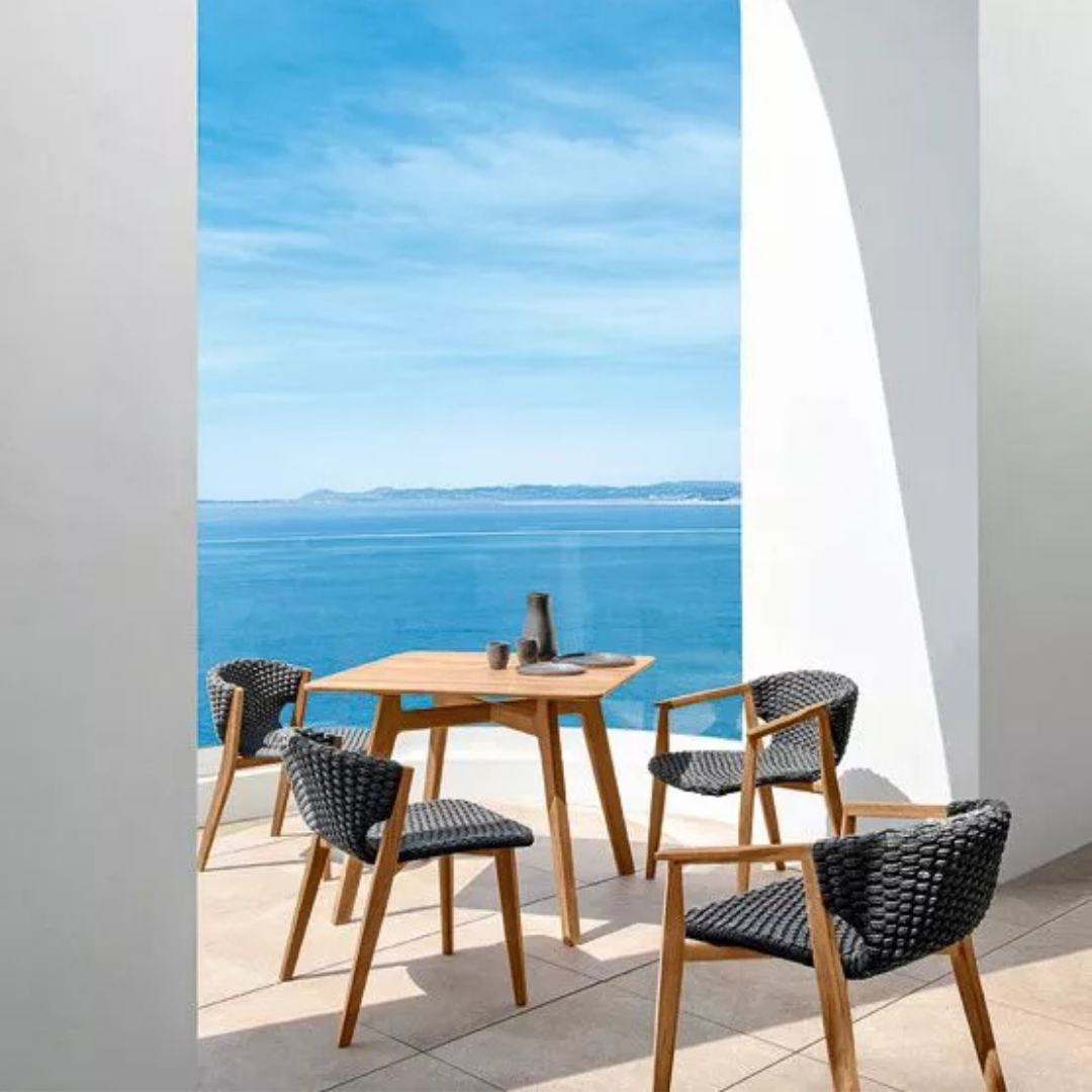 Ethimo Italian outdoor furniture in teak and refined finishes, displayed at Royal Interiors Singapore showroom