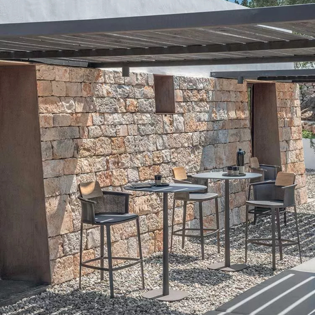 Ethimo Italian outdoor furniture in teak and refined finishes, displayed at Royal Interiors Singapore showroom