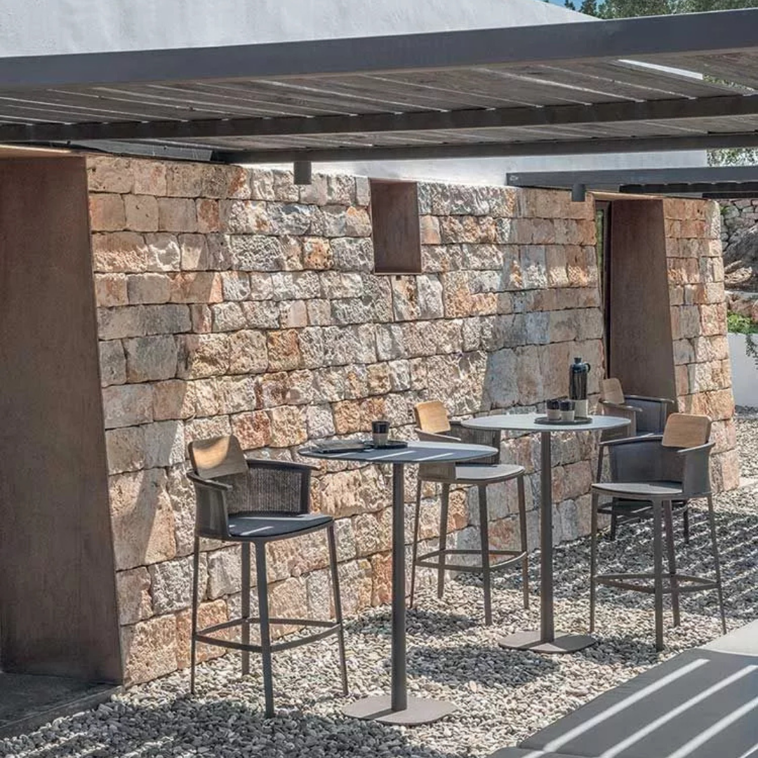 Ethimo Italian outdoor furniture in teak and refined finishes, displayed at Royal Interiors Singapore showroom