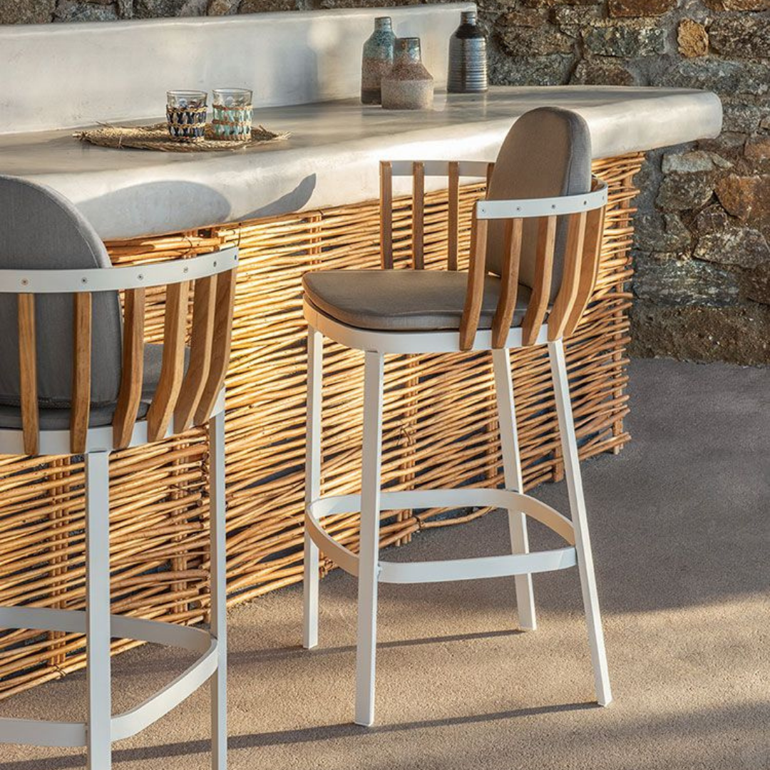 Ethimo Italian outdoor furniture in teak and refined finishes, displayed at Royal Interiors Singapore showroom