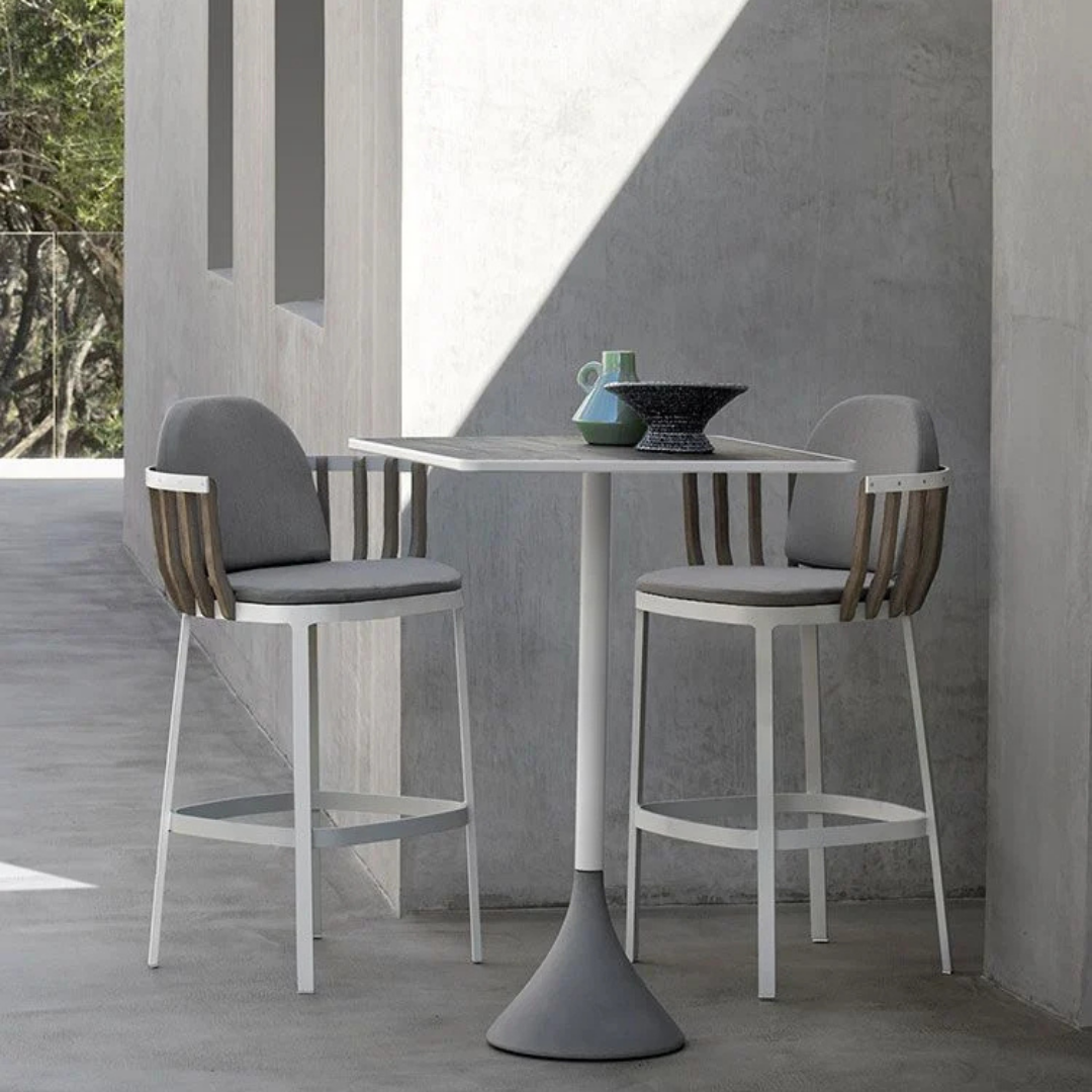 Ethimo Italian outdoor furniture in teak and refined finishes, displayed at Royal Interiors Singapore showroom