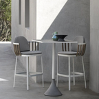 Ethimo Italian outdoor furniture in teak and refined finishes, displayed at Royal Interiors Singapore showroom