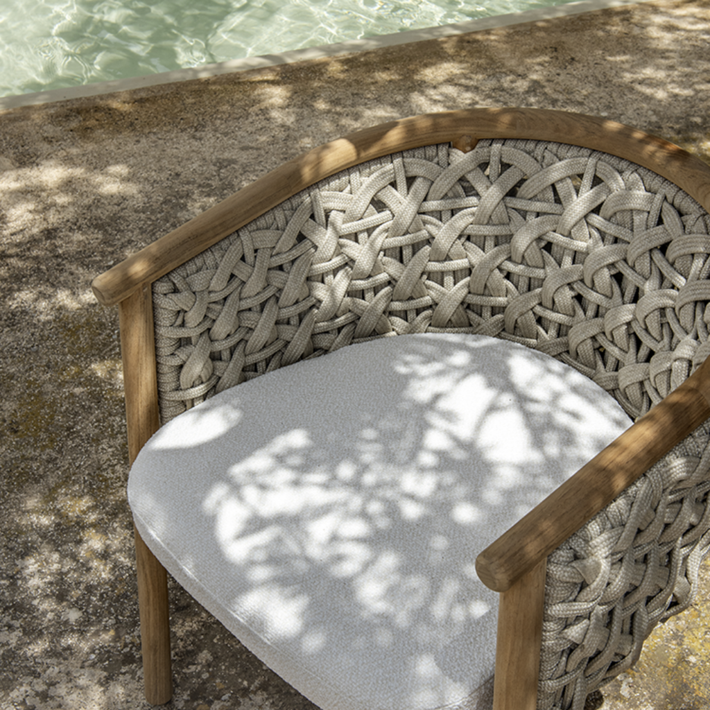 Ethimo Italian outdoor furniture in teak and refined finishes, displayed at Royal Interiors Singapore showroom