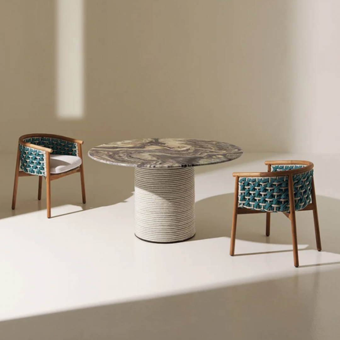 Ethimo Italian outdoor furniture in teak and refined finishes, displayed at Royal Interiors Singapore showroom