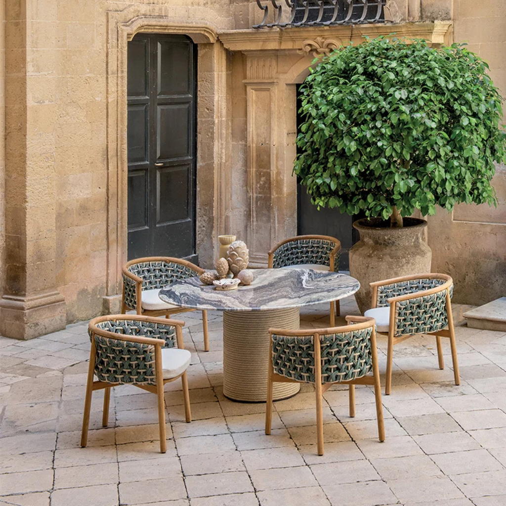 Ethimo Italian outdoor furniture in teak and refined finishes, displayed at Royal Interiors Singapore showroom