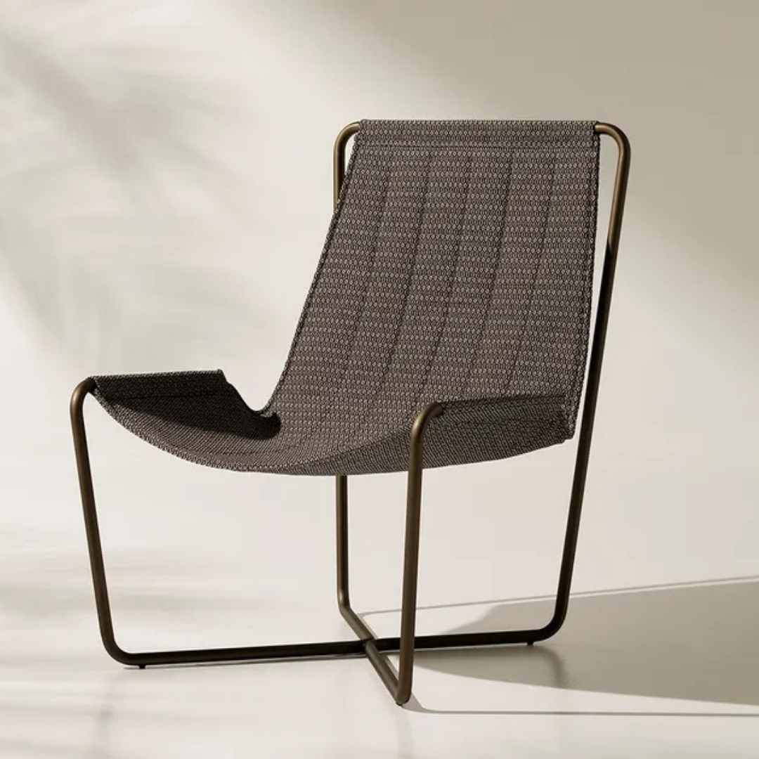 Ethimo Italian outdoor furniture in teak and refined finishes, displayed at Royal Interiors Singapore showroom