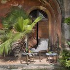 Ethimo Italian outdoor furniture in teak and refined finishes, displayed at Royal Interiors Singapore showroom