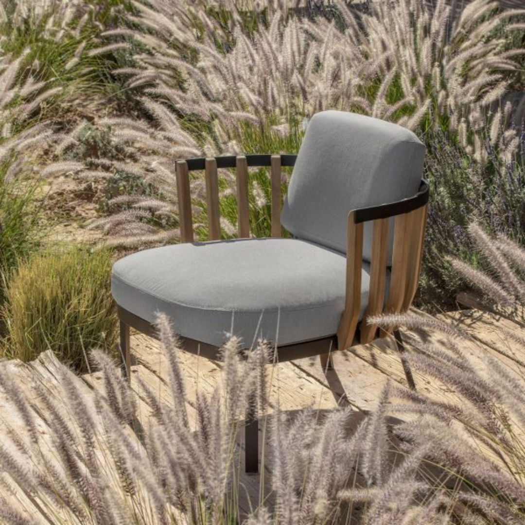 Ethimo Italian outdoor furniture in teak and refined finishes, displayed at Royal Interiors Singapore showroom