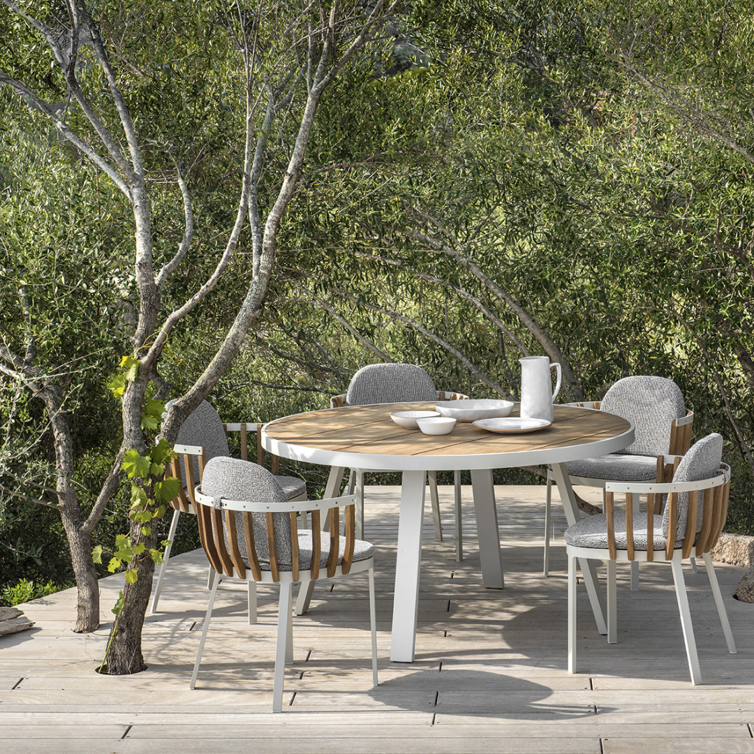 Ethimo Italian outdoor furniture in teak and refined finishes, displayed at Royal Interiors Singapore showroom