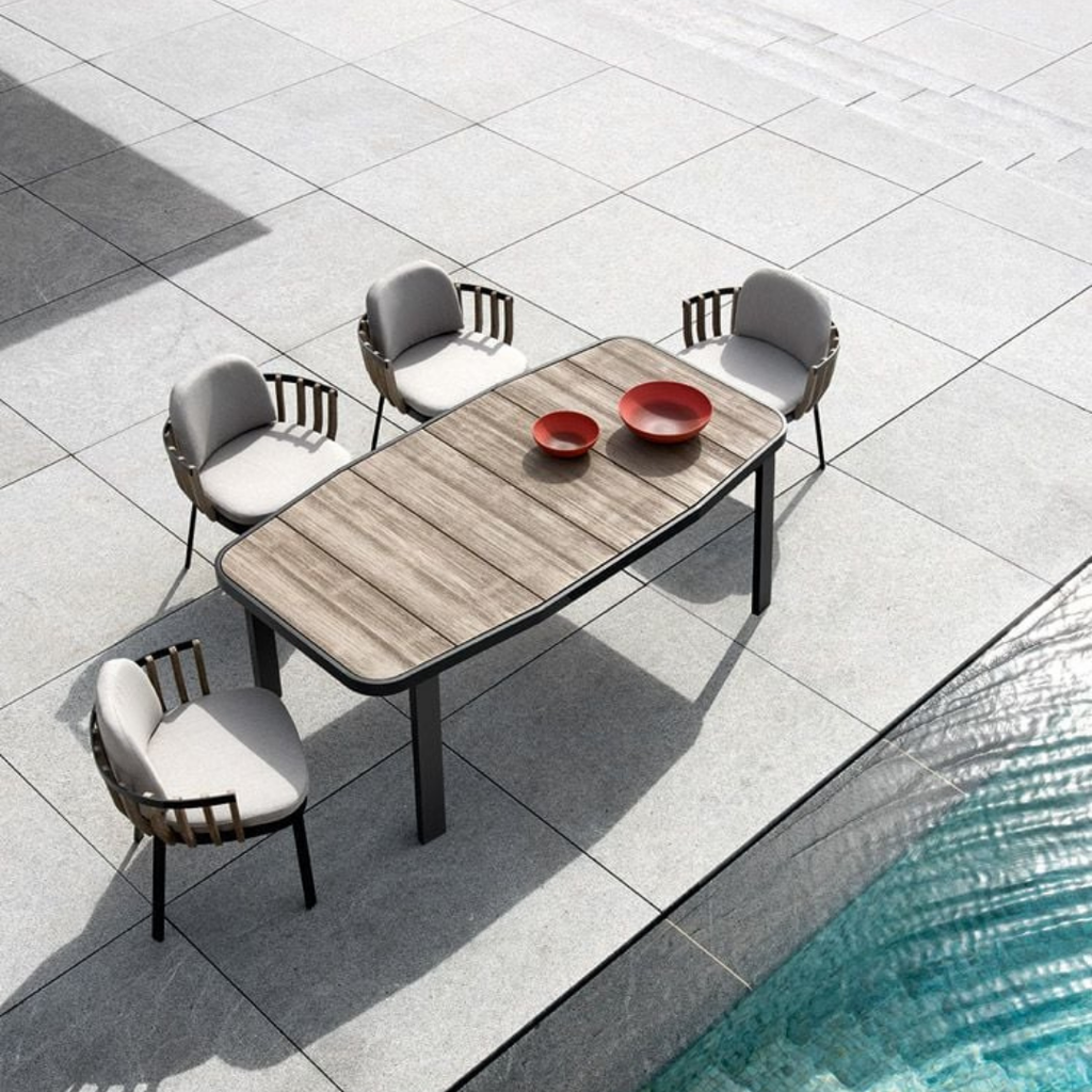 Ethimo Italian outdoor furniture in teak and refined finishes, displayed at Royal Interiors Singapore showroom