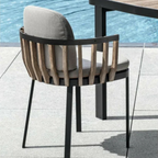 Ethimo Italian outdoor furniture in teak and refined finishes, displayed at Royal Interiors Singapore showroom