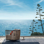 Ethimo Italian outdoor furniture in teak and refined finishes, displayed at Royal Interiors Singapore showroom