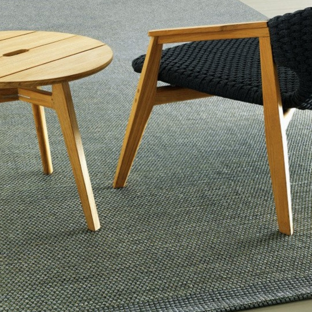 Ethimo Italian outdoor furniture in teak and refined finishes, displayed at Royal Interiors Singapore showroom