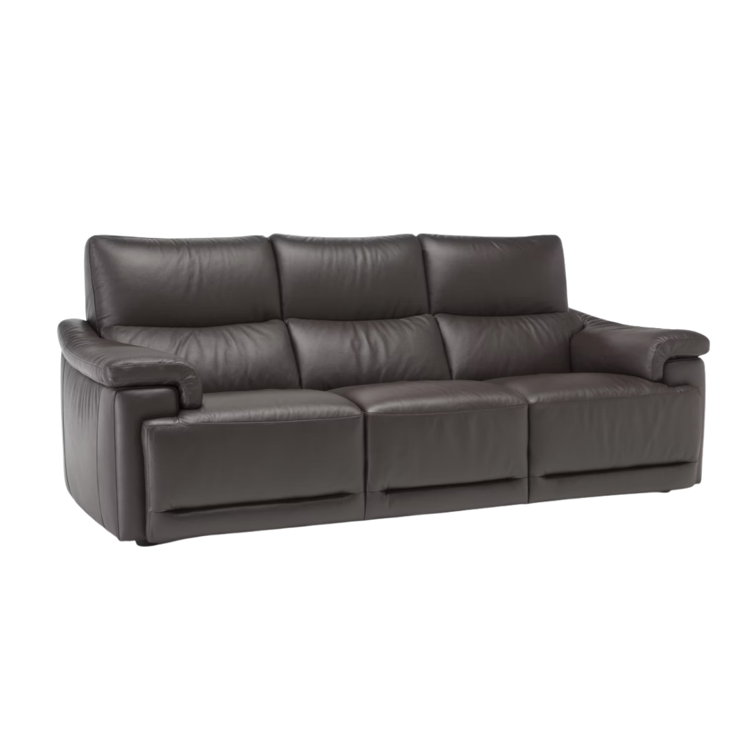 Natuzzi Editions indoor furniture including lounge armchairs, coffee tables, side tables, and bedside tables at Royal Interiors Singapore showroom.