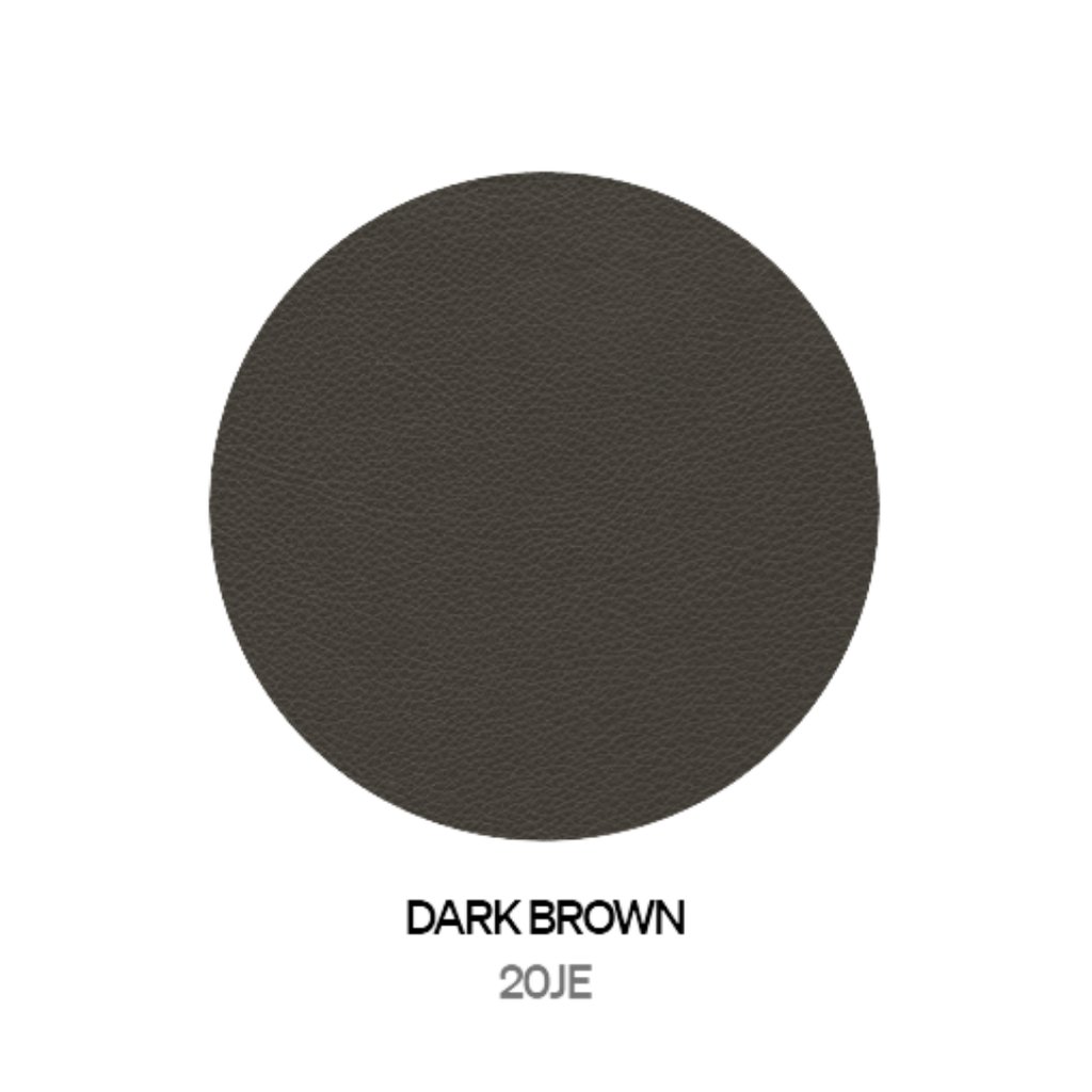 Natuzzi Editions indoor furniture including lounge armchairs, coffee tables, side tables, and bedside tables at Royal Interiors Singapore showroom.