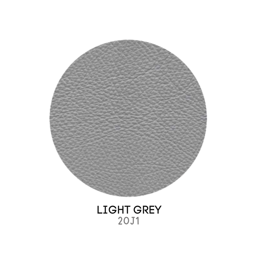 Natuzzi Editions indoor furniture including lounge armchairs, coffee tables, side tables, and bedside tables at Royal Interiors Singapore showroom.