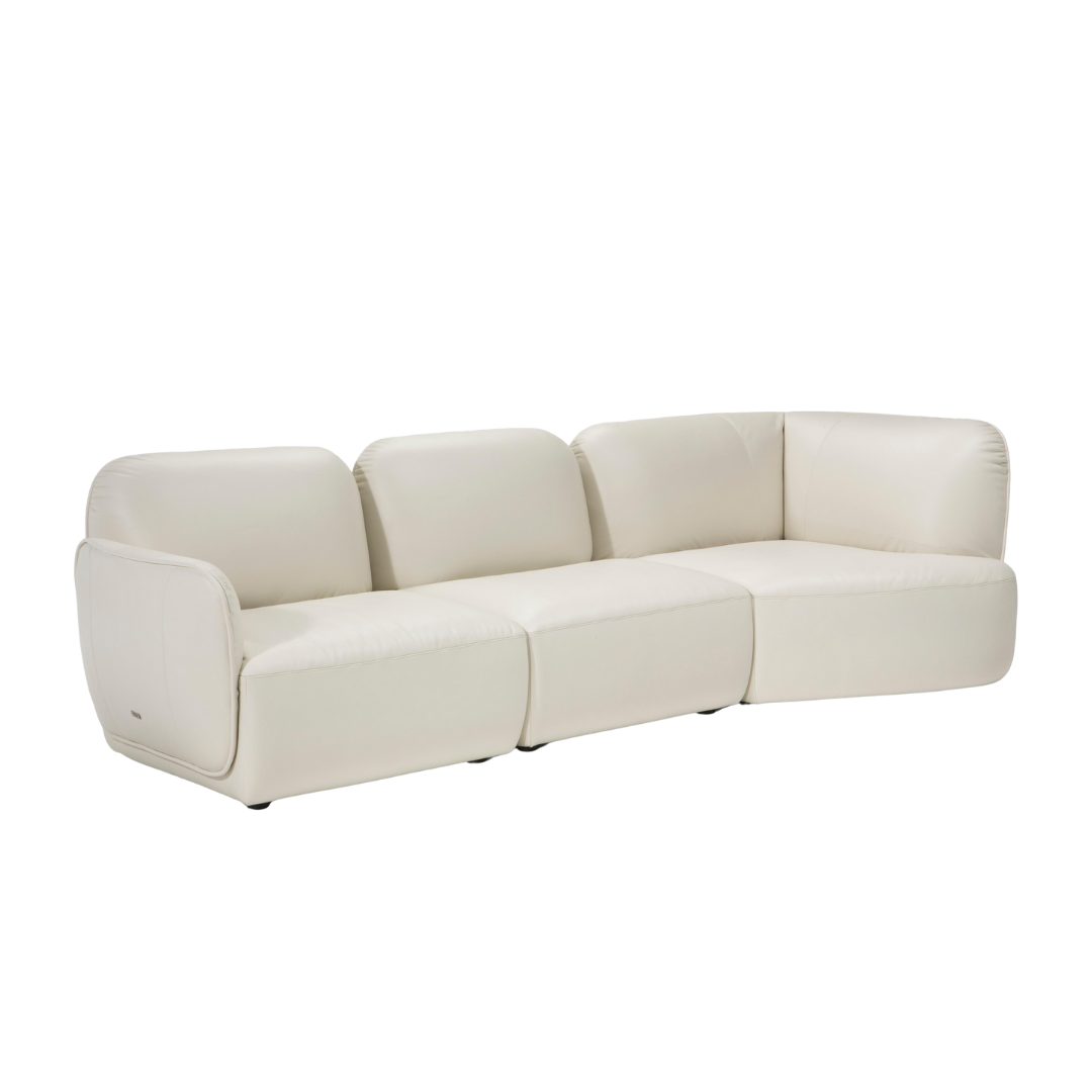 Natuzzi Editions indoor furniture including lounge armchairs, coffee tables, side tables, and bedside tables at Royal Interiors Singapore showroom.
