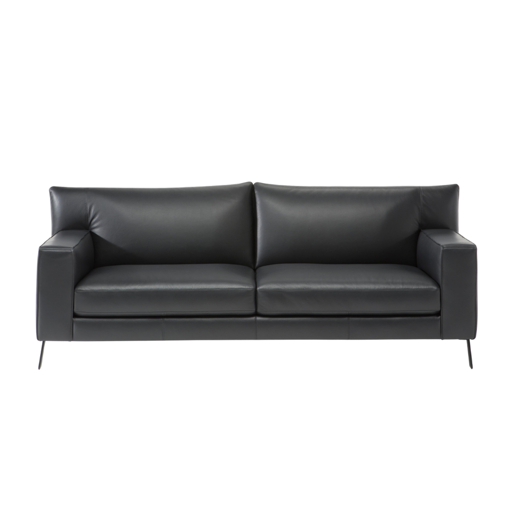 Natuzzi Editions indoor furniture including lounge armchairs, coffee tables, side tables, and bedside tables at Royal Interiors Singapore showroom.