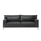 Natuzzi Editions indoor furniture including lounge armchairs, coffee tables, side tables, and bedside tables at Royal Interiors Singapore showroom.